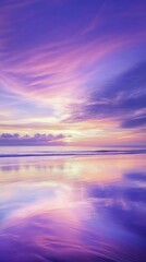 Obraz premium Serene beach sunset with vibrant purple and pink sky reflecting on calm ocean waves, creating a peaceful tropical seascape perfect for relaxation, nature beauty, and tranquil coastal landscape concept