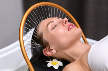 Head spa with golden arc and tropical flower