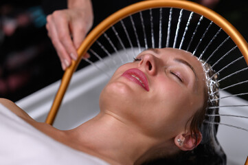 Relaxing head spa with golden water arc