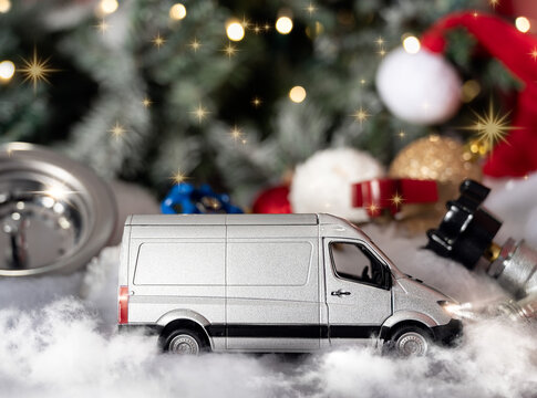 Holiday composition featuring a plumbing company van with Christmas ornaments and New Year elements