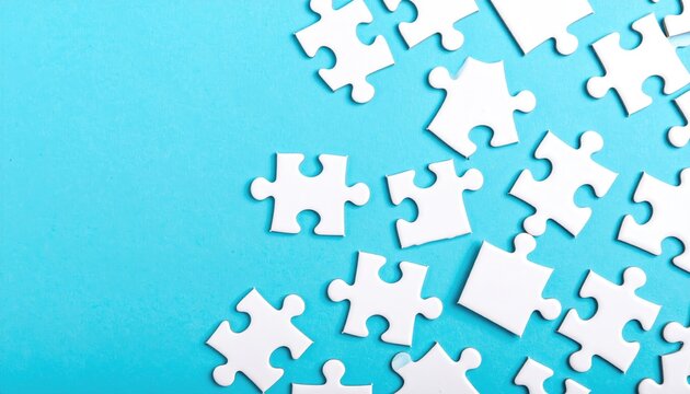 White puzzle pieces are scattered haphazardly on a light blue background, creating an incomplete mosaic of potential connections