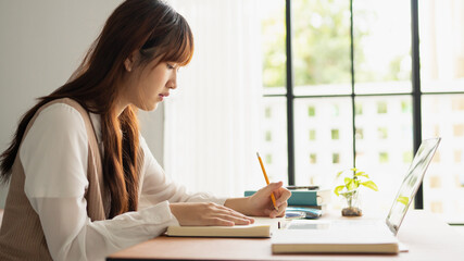 Asian student woman online learning from home