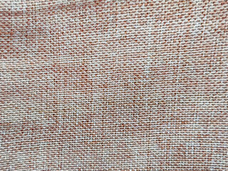 Close-up of a woven linen fabric with a brown and white textured pattern, perfect for a rustic,...