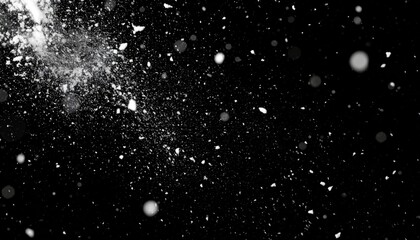 Obraz premium Abstract white powder bursts against a stark black backdrop. Blurred circular bokeh lights float and drift, creating a dynamic, speckled, textured effect