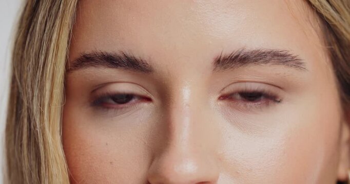 Beauty, mascara and eyes with portrait of woman in studio for self care, peptide growth and glow. Collagen, shine and lash lift with closeup of female person on white background for facial and zoom