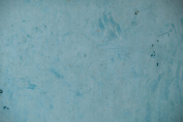 Texture of an old surface painted in light blue. Abstract background.