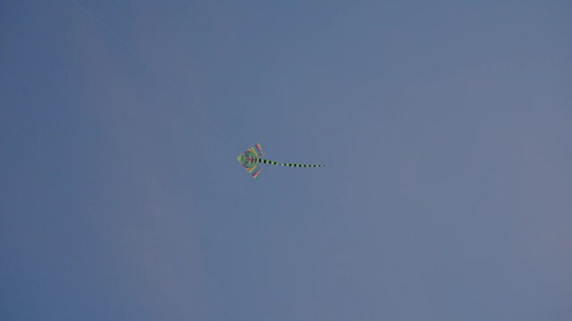 View of a kite in the sky, gently moving.