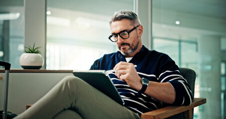 Tablet, stylus and travel with man in airport lounge for booking information, boarding pass and...