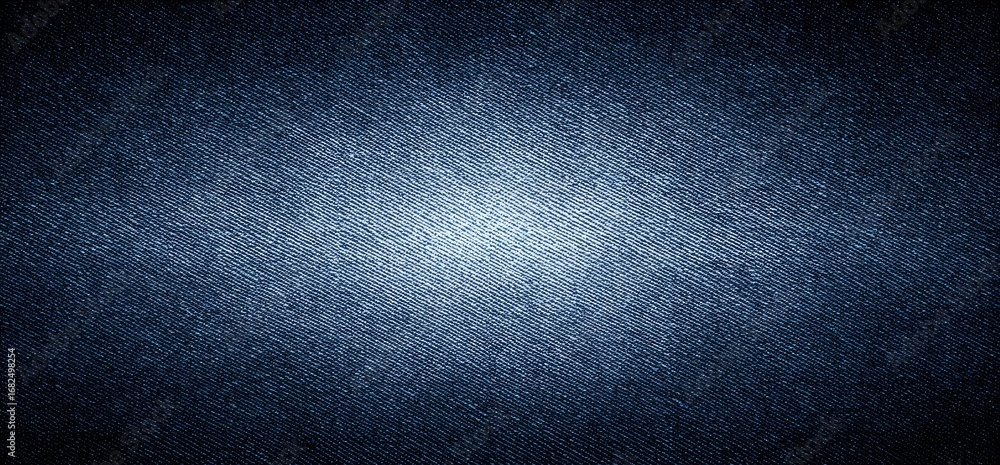 Poster a close-up view of deep indigo denim fabric, showcasing its textured weave and subtle variations in 