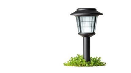 Black solar-powered garden lamppost with a frosted glass shade, standing on a bed of greenery