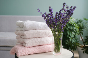 A stack of towels and lavender. The concept of protecting clothes from moths