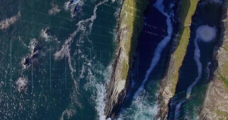 Animation of financial graphs and data over sea and land top view - Powered by Adobe