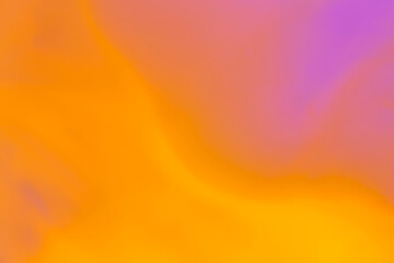 artistic backdrop: close up of orange and purple liquid watercolor paint splashes