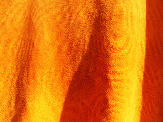 Background of an orange towel.