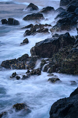 waves crashing on rocks