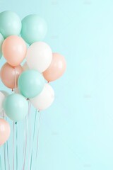 Pastel balloons floating against a light blue background with ribbons