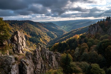 Obraz premium 1. Autumn cliffside with forests cascading down into valleys, dramatic sky above 