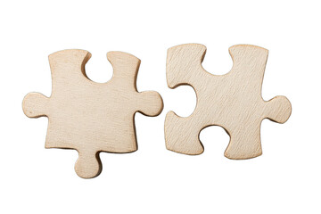 Two light beige wooden puzzle pieces, meeting but not quite connected