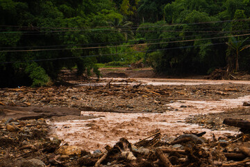 Flood Aftermath with Muddy Water and Debris Blocking Rural Area