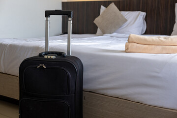 Modern hotel room interior with traveler’s suitcase highlighting tourism, business, and comfort