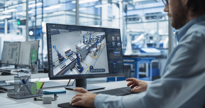 Factory Design Production: Engineer Works with Advanced 3d Cad Software to Model Robotic Assembly Line. High-tech Innovative Manufacturing Progress for Next-generation Production Processes, Automation