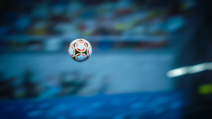Soccer Ball Flying Across the Stadium. Ball's Flight Leads to Goal, Success, and Victory. Swirling Ball, Arena with Crowds of Fans Cheering for the Champion Winning Team. Medium Close-up Shot