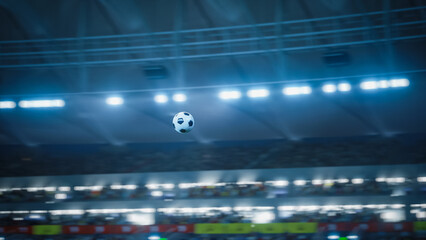 Soccer Ball Flying Across the Stadium. Ball's Flight Leads to Goal, Success, Victory. Swirling Ball, Arena with Crowds of Fans Cheering for the Champion Winning Team
