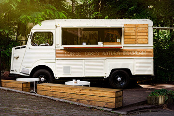 Street coffeeshop bus in the summer park	