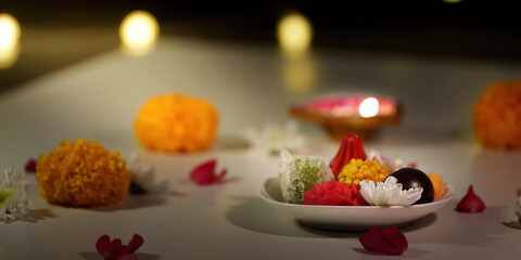Diwali Celebration. Colorful sweets and flowers on a festive table with candles.