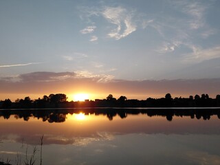 Summer evening sunset by the lake