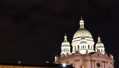 Obraz premium Illuminated architectural domes glow against darkness