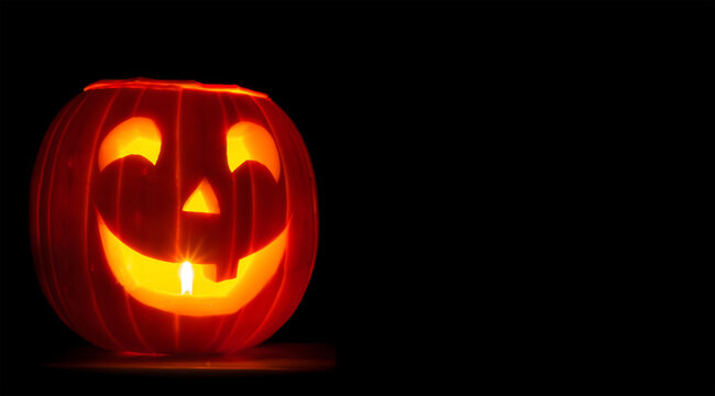 Jack-o-Lantern with Luminescent Cutouts on Dark