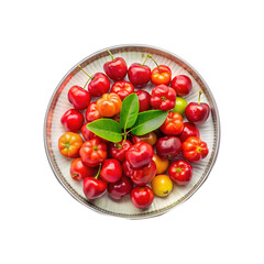 A colorful plate of fresh Barbados cherries with green leaves