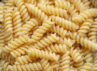 Top view of cooked fusilli pasta for background