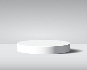 Minimalist white round podium on a clean gray background with soft shadow, perfect for product display or presentation.