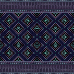 Native fabric pattern in shades of navy blue, purple, and blue-green. The main pattern in the center is a diamond pattern, layered and continuous in a long strip. It is decorated with small geometric 