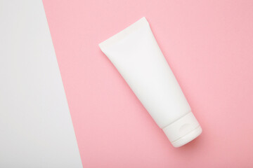 Mockup of medical skin care bottle cosmetic tube of beauty makeup facial on pink background.