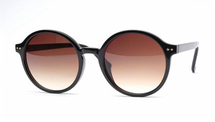 A pair of round, black-rimmed sunglasses with gradient brown lenses is centered on a white background, presenting a clear, eye-level studio shot