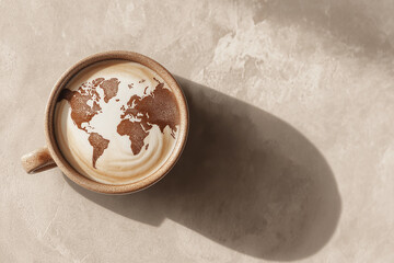 latte art shaped like a world map, ceramic cup on a marble table