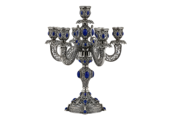 Ornate silver candleholder with detailed filigree design and blue gemstone accents, showcasing a classic and elegant aesthetic.