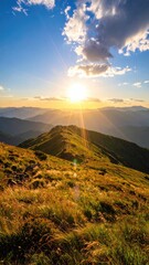 Obraz premium A stunning sunrise over rolling grassy mountains, bathed in golden light, with a vibrant blue sky and scattered clouds