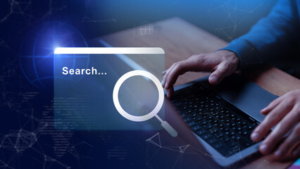 Searching for information using a laptop in a modern workspace during the daytime