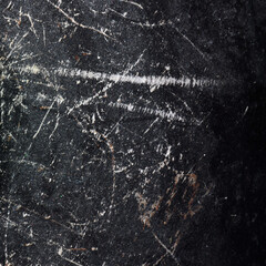 Black metal texture with scratches. For use as a background or texture.