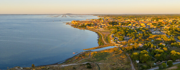 Aerial panorama of Mèze at sunrise, in Occitanie, France