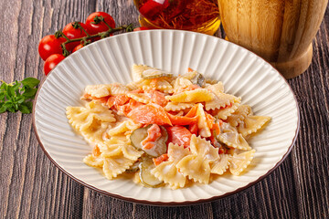 Italian pasta farfalle with salmon
