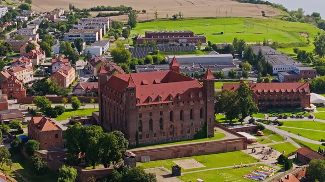 Aerial of Gniew Castle with medieval walls and surrounding town in summer Poland