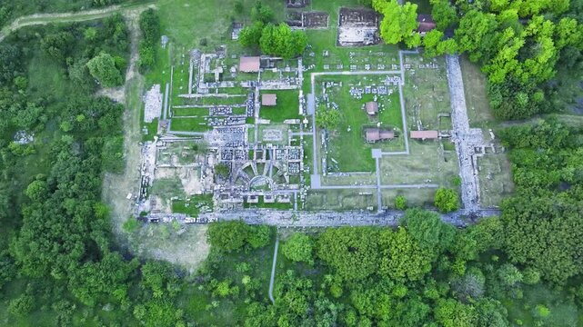 Aerial pullback shot of Nicopolis ad Istrum, ancient Roman city ruins near Veliko Tarnovo, Bulgaria.