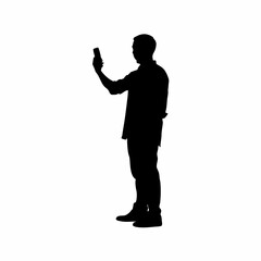 Silhouette of a man holding an air conditioner remote control