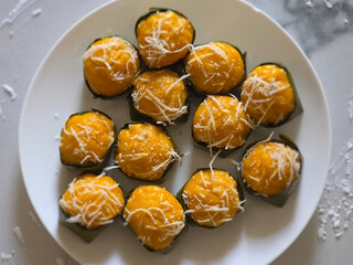 Yellow  Toddy Palm Cake (Khanom Tan) with coconut topping