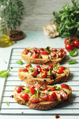 Freshly made bruschetta sandwiches - traditional dish of Italian cuisine